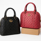 Embossed Monogram Dome Handbag